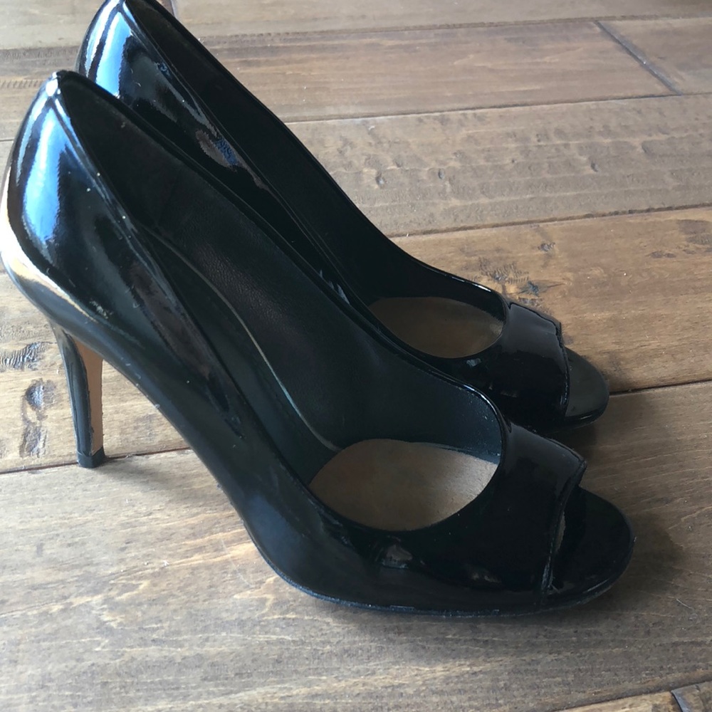 Black patent peep toe Stuart Weitzman pumps